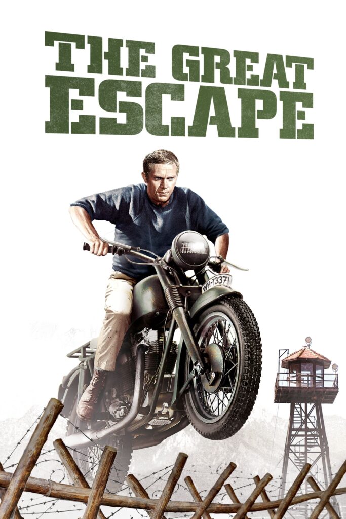 The poster for The Great Escape; Steve McQueen is jumping a motorcycle over barbed wire with a prison guard tower in the background